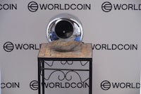 An orb, a spherical iris scanning device used by Worldcoin, is shown at a co-working office in Santa Monica, Calif., on Thursday, Aug. 3, 2023. Weeks after its international launch, Worldcoin is drawing the attention of privacy regulators around the world. The international ID startup is now having to defend itself in investigations over whether the biometric data that the company is collecting is truly secure. (AP Photo/Damian Dovarganes)