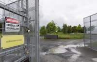 The City of Montreal has announced its ambitious plan to construct a new neighbourhood in the city's heart of the city. A gated fence leads into the site of the former Hippodrome racetrack in Montreal, Thursday, June 29, 2023. THE CANADIAN PRESS/Christinne Muschi
