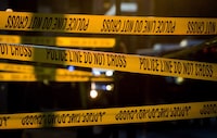 Police tape cordons off a crime scene in the Downtown Eastside of Vancouver, B.C., on Thursday April 9, 2015. A shooting at a home in Abbotsford, B.C. has left one person dead.THE CANADIAN PRESS/Darryl Dyck