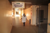 A nurse walks in a corridor of the general hospital in Namey, Niger April 13, 2024. REUTERS/ Mahamadou Hamidou