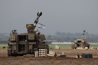 Israeli army tanks are deployed opposite the border with the Gaza Strip in southern Israel, on December 14, 2023, amid ongoing battles with the Palestinian Hamas movement. Israel continued bombing Gaza on December 14 as a top White House adviser travelled to Jerusalem with a rift growing over civilian casualties. (Photo by JACK GUEZ / AFP) (Photo by JACK GUEZ/AFP via Getty Images)