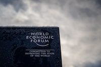 A photograph shows a sign of the World Economic Forum (WEF) in the alpine resort of Davos, on the opening day of the annual meeting in Davos on January 16, 2023. - The world's political and business elites gather for the annual Davos summit to promote "cooperation in a fragmented world", with war in Ukraine, the climate crisis and global trade tensions high on the agenda. (Photo by Fabrice COFFRINI / AFP) (Photo by FABRICE COFFRINI/AFP via Getty Images)