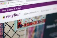 Wayfair says about 50 Canadians are part of a layoff impacting 1,650 employees at the furniture company.This April 17, 2018, file photo shows the Wayfair website on a computer in New York. THE CANADIAN PRESS/AP/Jenny Kane