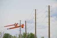 <p>Hydro Crews work to fix broken power poles and restore power in the Ottawa Valley municipality of Mississippi Mills, Ontario on Tuesday, May 24, 2022. Hydro One says high winds have knocked out power for thousands in Ontario. The electricity distributor says about 23,000 customers are without power as of mid-morning. &nbsp;THE CANADIAN PRESS/Sean Kilpatrick</p>
