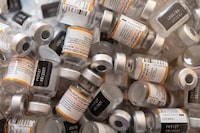 FILE PHOTO: Empty vials of Pfizer-BioNTech coronavirus disease (COVID-19) children's vaccines are pictured at Skippack Pharmacy in Schwenksville, Pennsylvania, U.S., May 19, 2022. REUTERS/Hannah Beier/File Photo