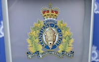 Police investigating the disappearance of a 17-year-old boy in P.E.I. say they found unidentified human remains today following the arrest last night of two youths. An RCMP logo is seen at a news conference, in St. John's, Saturday, June 24, 2023. THE CANADIAN PRESS/Adrian Wyld