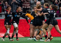 Canada's Charity Williams, left and Asia Hogan-Rochester celebrate with teammates after defeating Australia during bronze medal Vancouver Sevens women's rugby action, in Vancouver, on Sunday, Feb. 25, 2024. THE CANADIAN PRESS/Ethan Cairns 