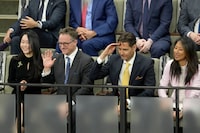 Michael Kovrig, a Canadian formerly detained in China, is calling on governments to have co-ordinated sanctions and travel bans on states who arrest foreigners for political reasons, through an effort Canada is co-leading to stop countries from feeling emboldened. Michael Spavor, centre left, and Kovrig, centre left, receive a standing ovation in the House of Commons prior to U.S. President Joe Biden's address of Parliament, in Ottawa, Friday, March 24, 2023. THE CANADIAN PRESS/Adrian Wyld
