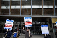 Art Gallery of Ontario employees walk a picket line outside the AGO in Toronto, Tuesday, March 26, 2024. The union representing hundreds of striking Art Gallery of Ontario workers says it's reached a tentative deal with the museum. THE CANADIAN PRESS/Cole Burston