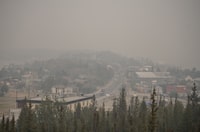 Heavy smoke from nearby wildfires fills the sky in Yellowknife on Tuesday, August 15, 2023. THE CANADIAN PRESS/Angela Gzowski