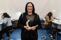 Rachel Bartholomew, founder and CEO at Hyivy Health, stands in her Waterloo, Ont. headquarters holding the Floora, the company’s Bluetooth-connected pelvic rehabilitation device.