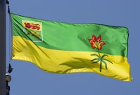 Saskatchewan's provincial flag flies on a flag pole in Ottawa on July 6, 2020. The Saskatoon Police Service is asking the public to turn in any video surveillance they may have from Chief Whitecap Park as they continue to search for a missing Indigenous woman and her son. THE CANADIAN PRESS/Adrian Wyld