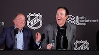 Gary Bettman, left, NHL commissioner, and Ryan Smith, co-founder and chairman of Smith Entertainment Group, react during a news conference to celebrate the awarding of a new NHL team to Utah, Friday, April 19, 2024, in Salt Lake City. (AP Photo/Rick Bowmer)