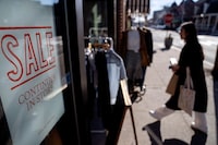 FILE - A shop holds a sidewalk sale on Feb. 10, 2023, in Providence, R.I. Inflation remains a top concern for small businesses, which reported lower optimism in February. (AP Photo/David Goldman, File)