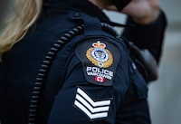 Police say a 44-year-old woman has been arrested in a hate-crime investigation over a speech in Vancouver that praised Hamas' Oct. 7 attack on Israel. A Vancouver Police Department patch is seen on an officer's uniform in Vancouver, B.C., Saturday, Jan. 9, 2021. THE CANADIAN PRESS/Darryl Dyck