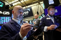 Traders work on the floor at the New York Stock Exchange (NYSE) on Jan. 23.