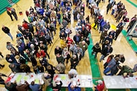 FILE - Registered Republican voters stand in line March 6, 2012, for the caucus event in Rathdrum, Idaho. Idaho Republicans will gather in presidential caucuses this Saturday, March 2, 2024, to help pick their party's presidential standard-bearer. Former president Donald Trump and former United UN Nikki Haley will compete for the state's 32 Republican delegates, as will Texas businessman and pastor Ryan Binkley. (AP Photo/Coeur d'Alene Press, Jerome A. Pollos)