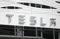 (FILES) The Tesla logo is seen at the Santa Monica Place store in Santa Monica, California, on March 20, 2023. Tesla reported a big drop in quarterly profits on April 23, 2024, pointing to elevated pressure on the electric vehicle market that has led to deep cost-cutting. Elon Musk's EV company reported profits of $1.1 billion, down 55 percent from the year-ago quarter on revenues of $21.3 billion, down nine percent. (Photo by Patrick T. Fallon / AFP) (Photo by PATRICK T. FALLON/AFP via Getty Images)