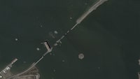 This satellite image provided by Planet Labs shows the container ship Dali lodged against the wreckage of the Francis Scott Key Bridge, Friday, March 29, 2024, in Baltimore, Md. (Planet Labs via AP)