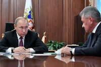 FILE - In this Feb. 2, 2019, file photo, Russian President Vladimir Putin, left, speaks to Defense Minister Sergei Shoigu during a Kremlin meeting in Moscow, Russia about suspending participation in the Intermediate Range Nuclear Forces Treaty signed in 1987 between the Soviet Union and the United States. On Tuesday, Nov. 7, 2023, Russia pulled out of the Treaty of Conventional Armed Forces in Europe and NATO member countries froze their participation in the pact, which was aimed at preventing the massing forces at or near their mutual borders, raising fresh questions about the future of arms control agreements in Europe. (Alexei Nikolsky, Sputnik, Kremlin Pool Photo via AP)
