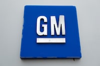 FILE - The General Motors logo is seen, Jan. 27, 2020, in Hamtramck, Mich. On Tuesday, Oct. 17, 2023, General Motors announced that it will delay electric pickup truck production at a factory near Detroit due to slowing U.S. demand for electric vehicles, to better manage its capital investments, and to make some engineering changes. (AP Photo/Paul Sancya, File)