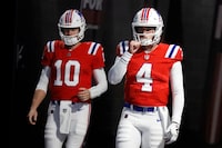 New England Patriots quarterback Bailey Zappe (4) and quarterback Mac Jones (10) take the field prior to an NFL football game against the Los Angeles Chargers, Sunday, Dec. 3, 2023, in Foxborough, Mass. (AP Photo/Michael Dwyer)