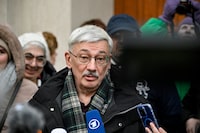 Oleg Orlov, the 70-year-old human rights campaigner and co-chair of the Nobel Prize winning Memorial group, who is charged with "discrediting" the Russian army, talks to the media and his supporters outside a court building in Moscow on February 26, 2024. A Russian prosecutor on February 26, 2024 requested a prison term of nearly three years for top human rights campaigner Oleg Orlov, who is on trial on a charge of repeatedly denouncing the Ukraine offensive. (Photo by Alexander NEMENOV / AFP) (Photo by ALEXANDER NEMENOV/AFP via Getty Images)
