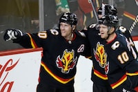 Calgary Flames' Blake Coleman, left, celebrates his goal against the Vegas Golden Knights with Jonathan Huberdeau during third period NHL hockey action in Calgary, Thursday, March 14, 2024. THE CANADIAN PRESS/Larry MacDougal