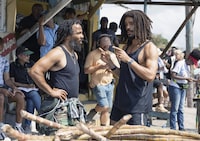 This image released by Paramount Pictures shows producer Ziggy Marley, left, and Kingsley Ben-Adir on the set of "Bob Marley: One Love." (Chiabella James/Paramount Pictures via AP)
