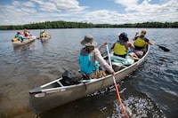 Canoe trip leaders and participants in a Project Canoe’s Wilderness Canoe program head out for a five day interior canoe trip, from Cache Lake in Algonquin Provincial Park, on July 12, 2023. (Fred Lum/The Globe and Mail) 