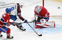 Colorado Avalanche's Nathan MacKinnon (29) scores against Montreal Canadiens goaltender Sam Montembeault as Canadiens' Mike Matheson defends during third period NHL hockey action in Montreal, Monday, March 13, 2023. THE CANADIAN PRESS/Graham Hughes