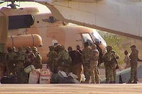 FILE  - This undated photograph handed out by French military shows Russian mercenaries boarding a helicopter in northern Mali. Russia's Wagner Group, a private military company led by Yevgeny Prigozhin, a rogue millionaire with longtime links to Russia's President Vladimir Putin, has played a key role in the fighting in Ukraine and also deployed its personnel to Syria, Central African Republic, Libya and Mali. (French Army via AP, File)