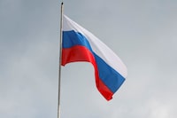FILE PHOTO: A Russian state flag flies over the Central Bank headquarters in Moscow, Russia, August 15, 2023. A sign reads: "Bank of Russia". REUTERS/Shamil Zhumatov/File Photo