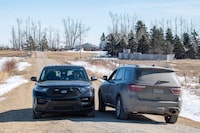 A RCMP vehicle secures the driveway of a home north east of Neudorf, Saskatchewan on Tuesday, March 26, 2024. Black unmarked RCMP vehicles could be seen blocking roads leading to a Saskatchewan farm property as officers continued to investigate the suspicious deaths of four people. THE CANADIAN PRESS/Liam Richards