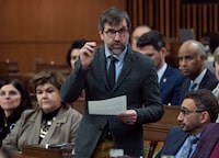 Minister of Environment and Climate Change Steven Guilbeault rises during Question Period, in Ottawa, Wednesday, March 29, 2023. THE CANADIAN PRESS/Adrian Wyld