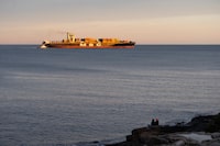 Canadian shippers are starting to feel the strain of attacks on cargo vessels in the Red Sea, as boats reach the Port of Halifax more than a week late and container rates soar. People watch as a vessel from the global shipping container company MSC departs Halifax Harbour in Halifax on Tuesday, December 26, 2023. THE CANADIAN PRESS/Darren Calabrese