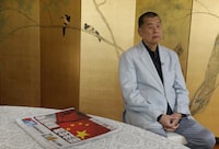 FILE - Hong Kong media tycoon Jimmy Lai pauses next to a copy of Apple Daily's July 1, 2020, edition during an interview Hong Kong Wednesday, July 1, 2020. Lai said in an interview Wednesday that Hong Kong is dead under the new national security law. Lai, who owns popular newspaper Apple Daily, is a prominent advocate for democracy in Hong Kong. (AP Photo/Vincent Yu, File)