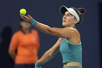 Bianca Andreescu, of Canada, serves against Ekaterina Alexandrova, of Russia, in the first set of a match at the Miami Open tennis tournament, Monday, March 27, 2023, in Miami Gardens, Fla. (AP Photo/Jim Rassol)