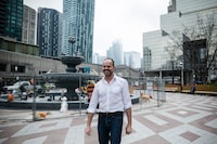 Landscape architect Claude Cormier is photographed in Toronto on Wednesday, April 19, 2017 in front of one of his latest projects in Berczy Park. Cormier says that for the piece, which features a fountain surrounded by  painted steel dogs, he drew inspiration from the neighbourhood dogs that are walked there everyday. 
(Christopher Katsarov/The Globe and Mail)