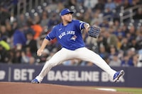 Toronto Blue Jays starting pitcher Yariel Rodriguez throws his first Major League pitch against Colorado Rockies during inning interleague MLB baseball action in Toronto, Saturday, April 13, 2024. THE CANADIAN PRESS/Chris Young