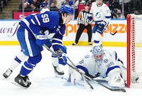 Tampa Bay Lightning goaltender Andrei Vasilevskiy (88) makes a save against Toronto Maple Leafs' Tyler Bertuzzi (59) during second period NHL hockey action in Toronto on Wednesday, April 3, 2024. THE CANADIAN PRESS/Chris Young