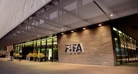 FILE - This Dec. 2, 2015 file photo shows the FIFA Headquarters in Zurich, Switzerland. A FIFA fund to compensate for unpaid wages helped 225 players in the latest round of payments. The governing body of soccer says 61 were with clubs in Portugal and 50 in Greece. The $16 million FIFA Fund for Football Players was created in 2020 with the FIFPRO player union.  (Walter Bieri/Keystone via AP, File)