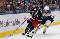 Dec 8, 2023; Columbus, Ohio, USA; Columbus Blue Jackets center Adam Fantilli (11) picks up a loose puck as St. Louis Blues left wing Brandon Saad (20) trails the play during the first period at Nationwide Arena. Mandatory Credit: Russell LaBounty-USA TODAY Sports