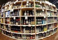 FILE - This June 16, 2016 file photo made with a fisheye lens shows bottles of alcohol during a tour of a state liquor store in Salt Lake City. A large international study released on Thursday, April 12, 2018 says adults should average no more than one alcoholic drink per day, and that means many countries’ alcohol consumption guidelines may be far too loose. (AP Photo/Rick Bowmer, File)