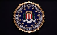 The Federal Bureau Investigation seal is seen at FBI headquarters before a news conference by FBI Director Christopher Wray on the U.S Justice Department's inspector general's report regarding the actions of the Federal Bureau of Investigation and the 2016 U.S. presidential election in Washington, U.S. June 14, 2018.    REUTERS/Jim Bourg