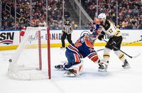 Boston Bruins' Nick Foligno (17) scores on Edmonton Oilers' goalie Stuart Skinner (74) during first period NHL action in Edmonton on Monday February 27, 2023.THE CANADIAN PRESS/Jason Franson 