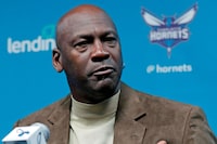FILE - In this Feb. 12, 2019, file photo, Charlotte Hornets owner Michael Jordan speaks to the media about hosting the NBA All-Star basketball game during a news conference in Charlotte, N.C. Jordan spoke to his Hornets players recently via video conference call about what it takes to be a champion, emphasizing the need for accountability, even if it means making teammates comfortable (AP Photo/Chuck Burton, File)