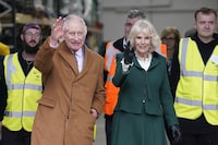 Britain's King Charles III and Queen Camilla arrive to mark the King's 75th birthday at the official launch of The Coronation Food Project, which aims to bridge the gap between food waste and food need across all four nations of the United Kingdom, at the South Oxfordshire Food and Education Alliance (SOFEA) surplus food distribution centre, in Didcot, Oxfordshire, England, Tuesday Nov. 14, 2023. (Andrew Matthews/PA via AP)