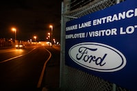 WINDSOR, CANADA - SEPTEMBER 19: A vehicle exits out of the Ford Windsor Engine Plant as negotiations continue past the 11:59pm strike deadline on September 19, 2023 in Windsor, Canada. The current contract that Ford, General Motors, and Stellantis had with UNIFOR, the union representing autoworkers in Canada, expired at 11:59pm on September 18. (Photo by Bill Pugliano/Getty Images)