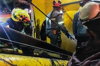 This handout picture released by Cundinamarca's Fire Department shows firefighters rescuing a miner after an explosion at a coal mine in Sutatausa municipality in the department of Cundinamarca, Colombia on March 15, 2023. - At least 11 people died and 10 are still trapped after an explosion in the interior of a coal mine tunnel in Colombia, the Governor of Cundinamarca department informed on Wednesday. (Photo by Cundinamarca Fire Department / AFP) / RESTRICTED TO EDITORIAL USE - MANDATORY CREDIT "AFP PHOTO / CUNDINAMARCA FIRE DEPARTMENT" - NO MARKETING NO ADVERTISING CAMPAIGNS - DISTRIBUTED AS A SERVICE TO CLIENTS (Photo by -/Cundinamarca Fire Department/AFP via Getty Images)